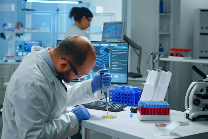 Laboratory technician analysing test samples